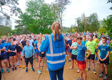 Amy delivers a briefing to runners